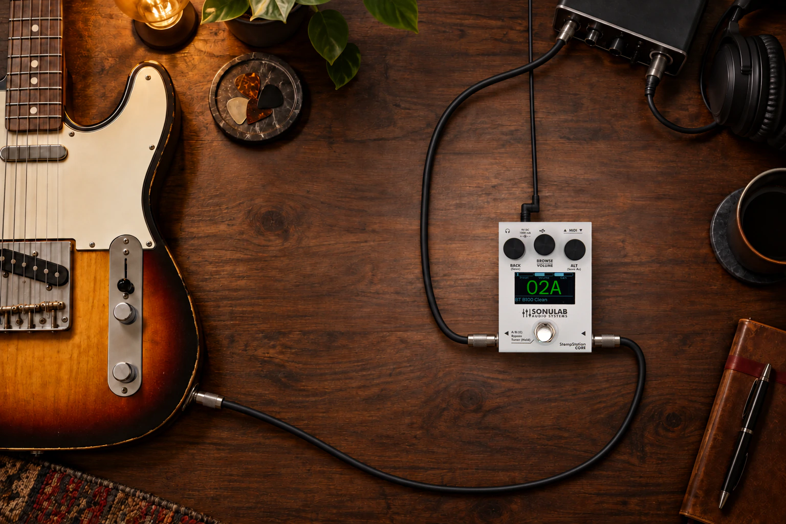 StompStation CORE connected to a guitar and audio interface, with side audio leads and top DC power.